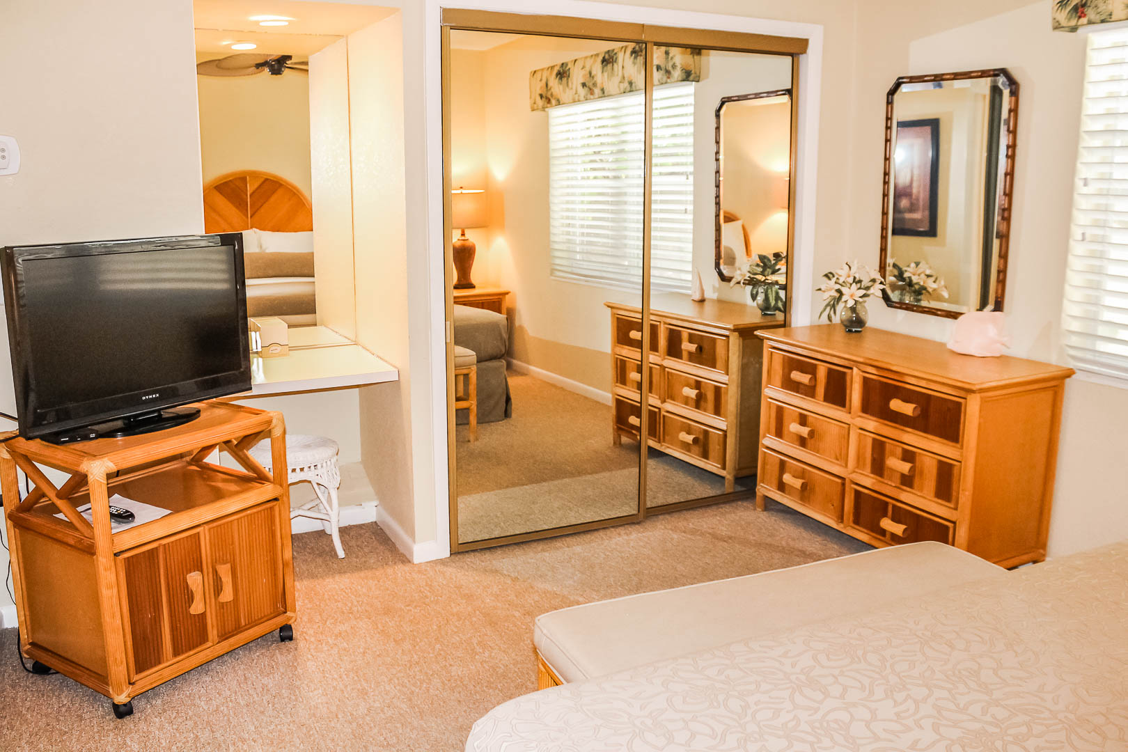 A cozy bedroom at VRI's Berkshire on the Ocean in Florida.